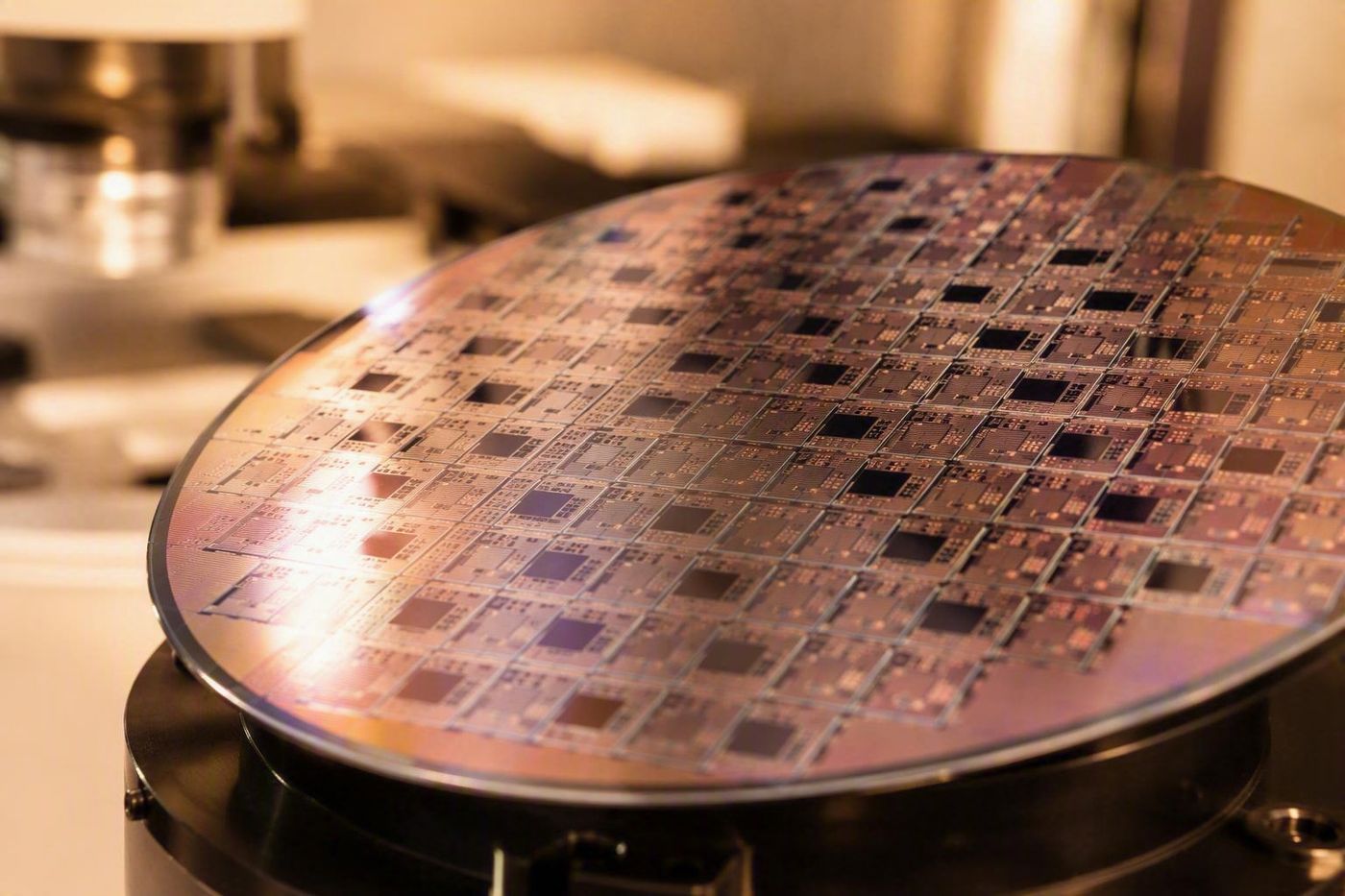 Patterned semiconductor wafer on a fabrication stage